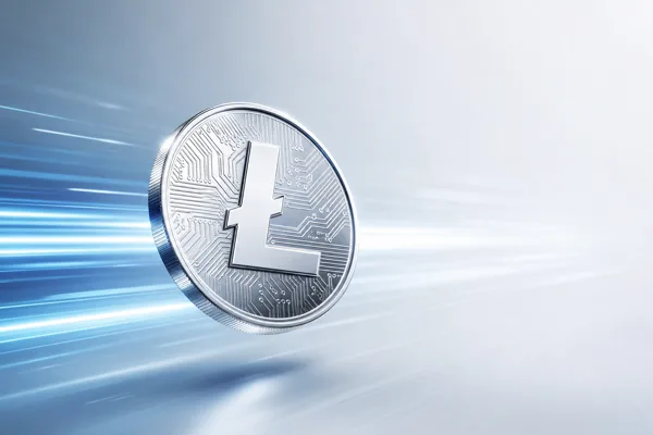 Silver Litecoin coin with circuit engraving and motion streaks representing fast low-cost payments